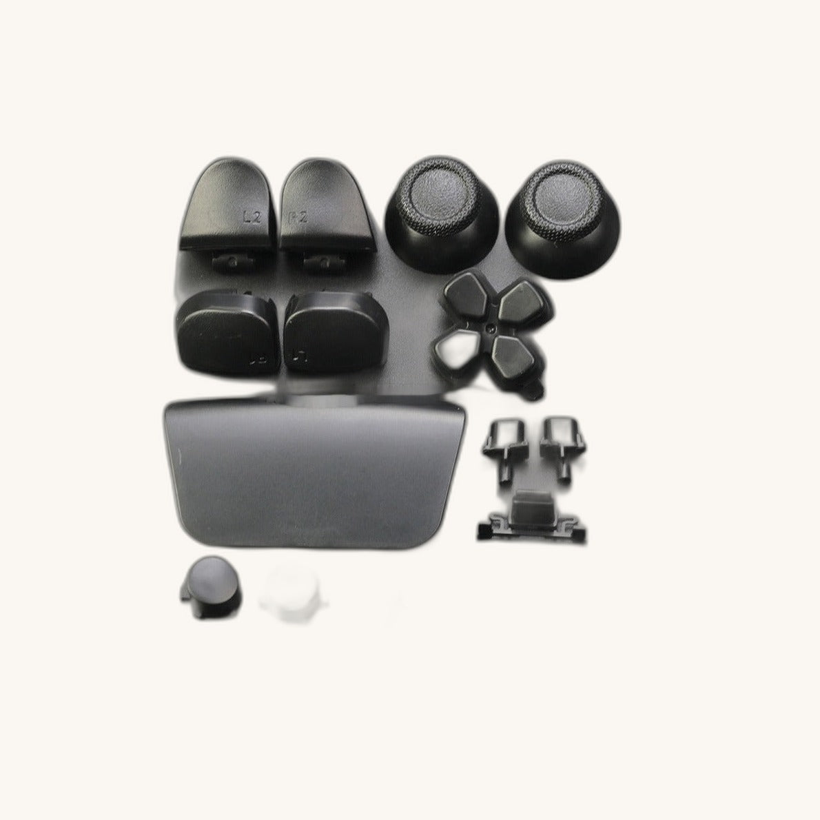 Knappesettet packshot krem